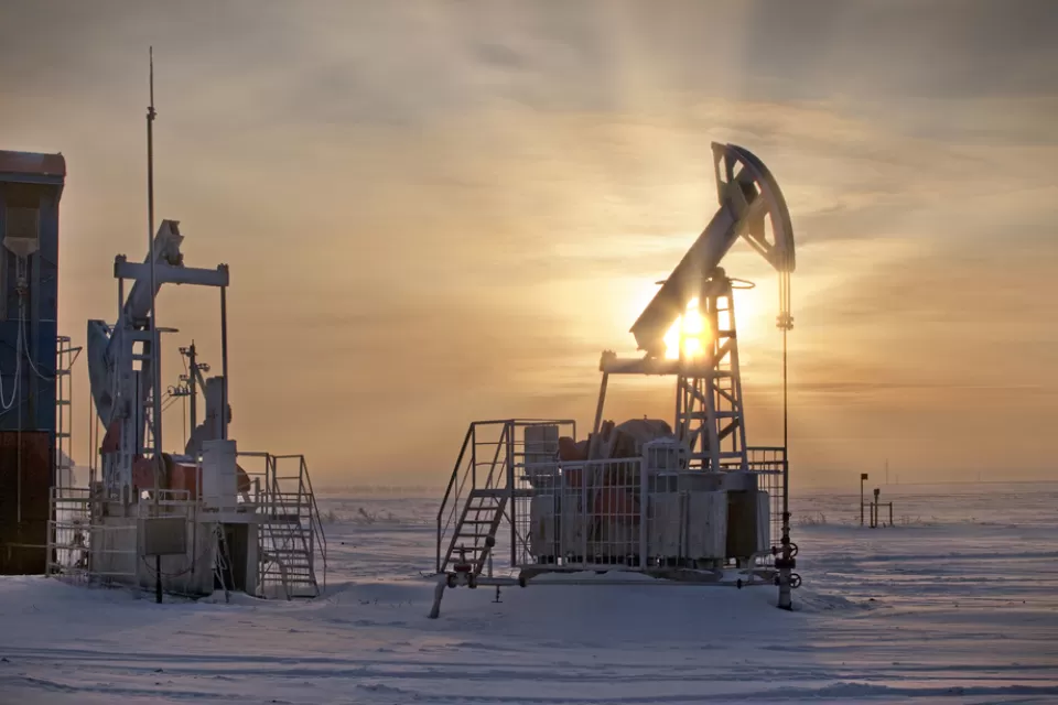 Oil extraction pumps in winter landscape in Russia
